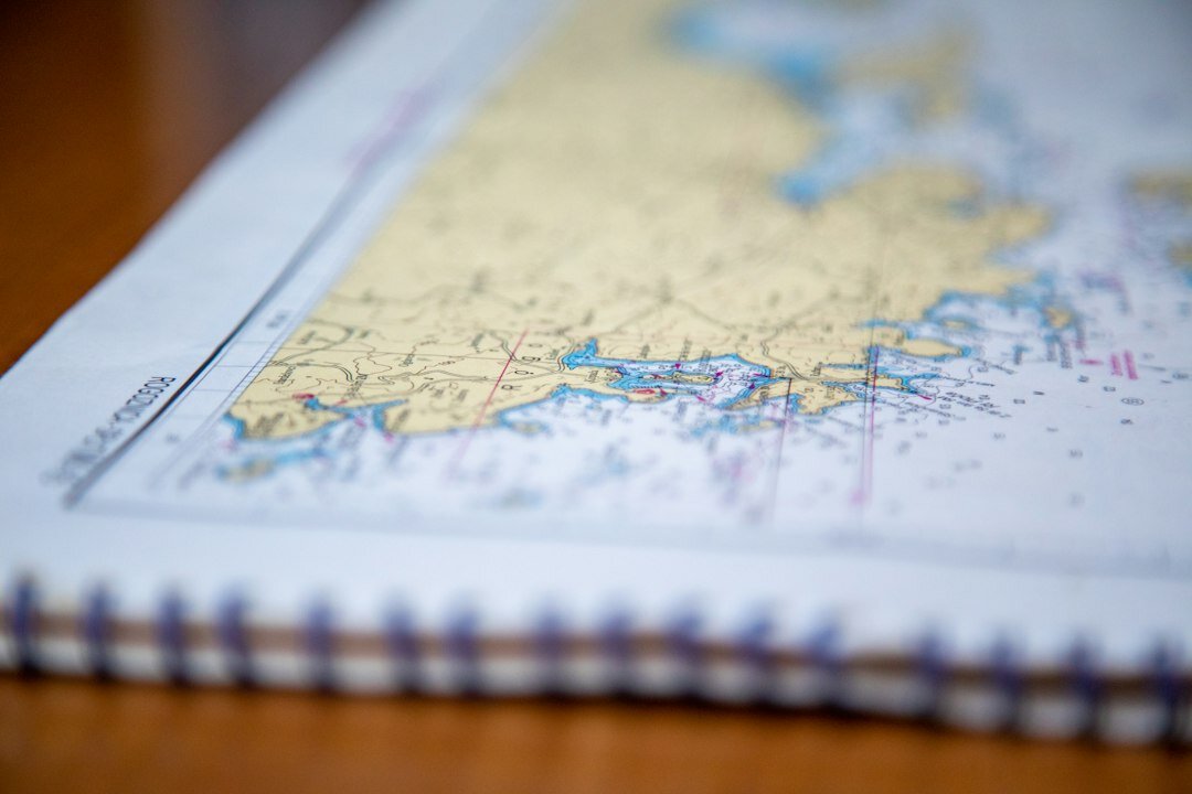 Close-up of printed charts and survey data on a desk