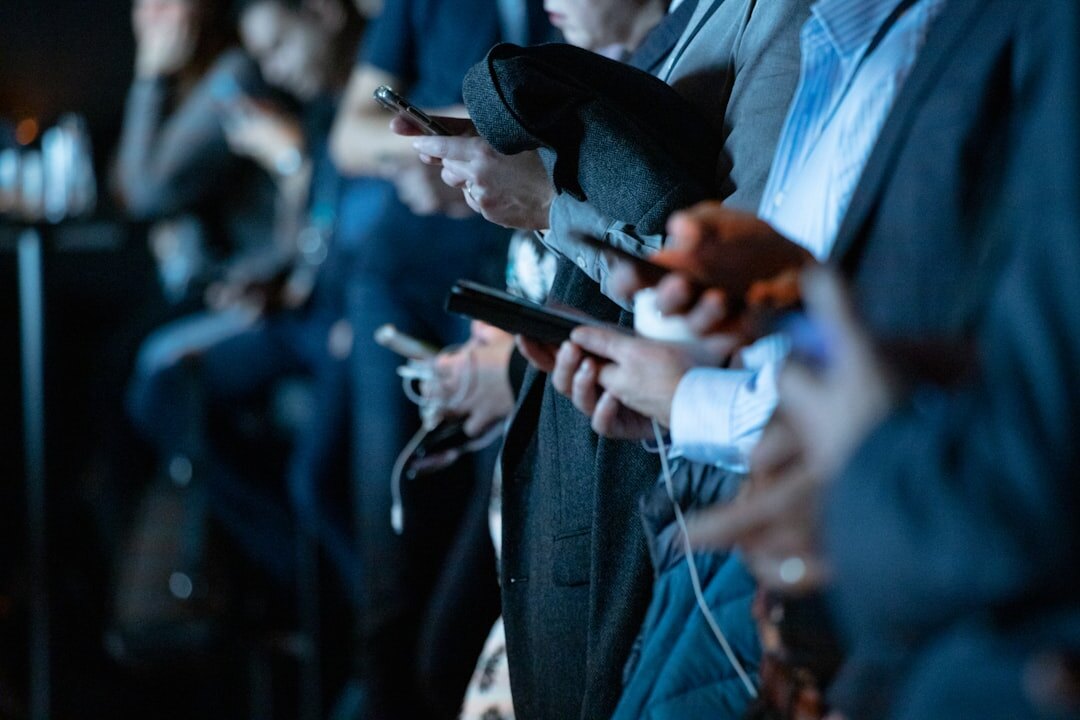 people using smartphones in public