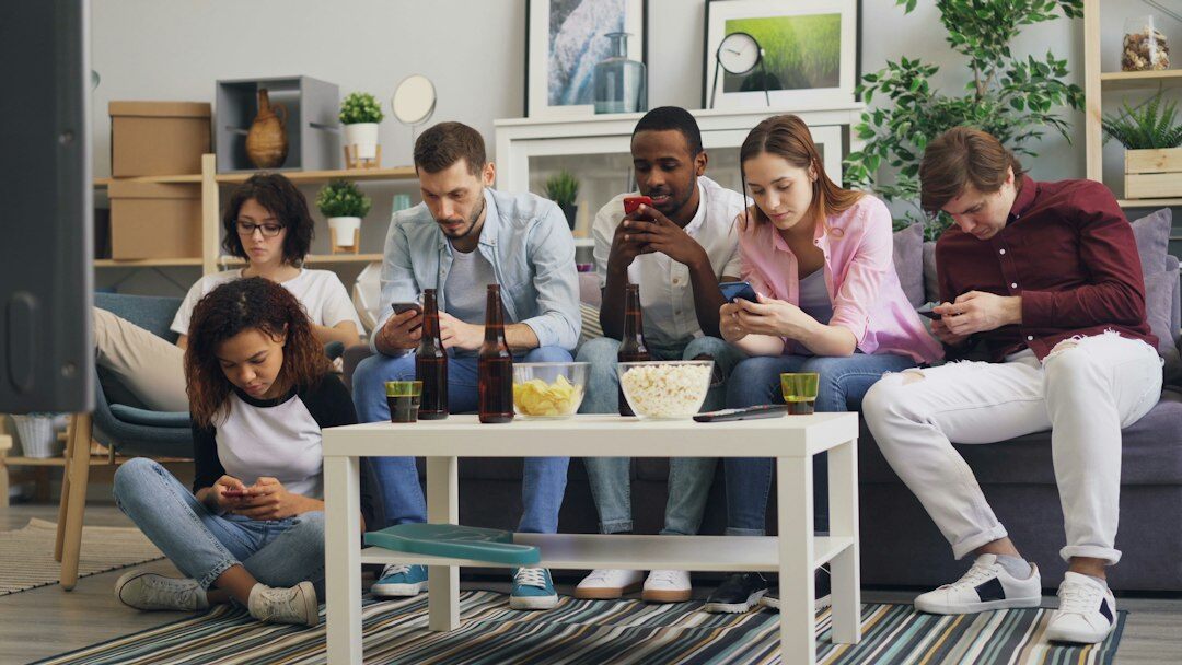 diverse young people using phones